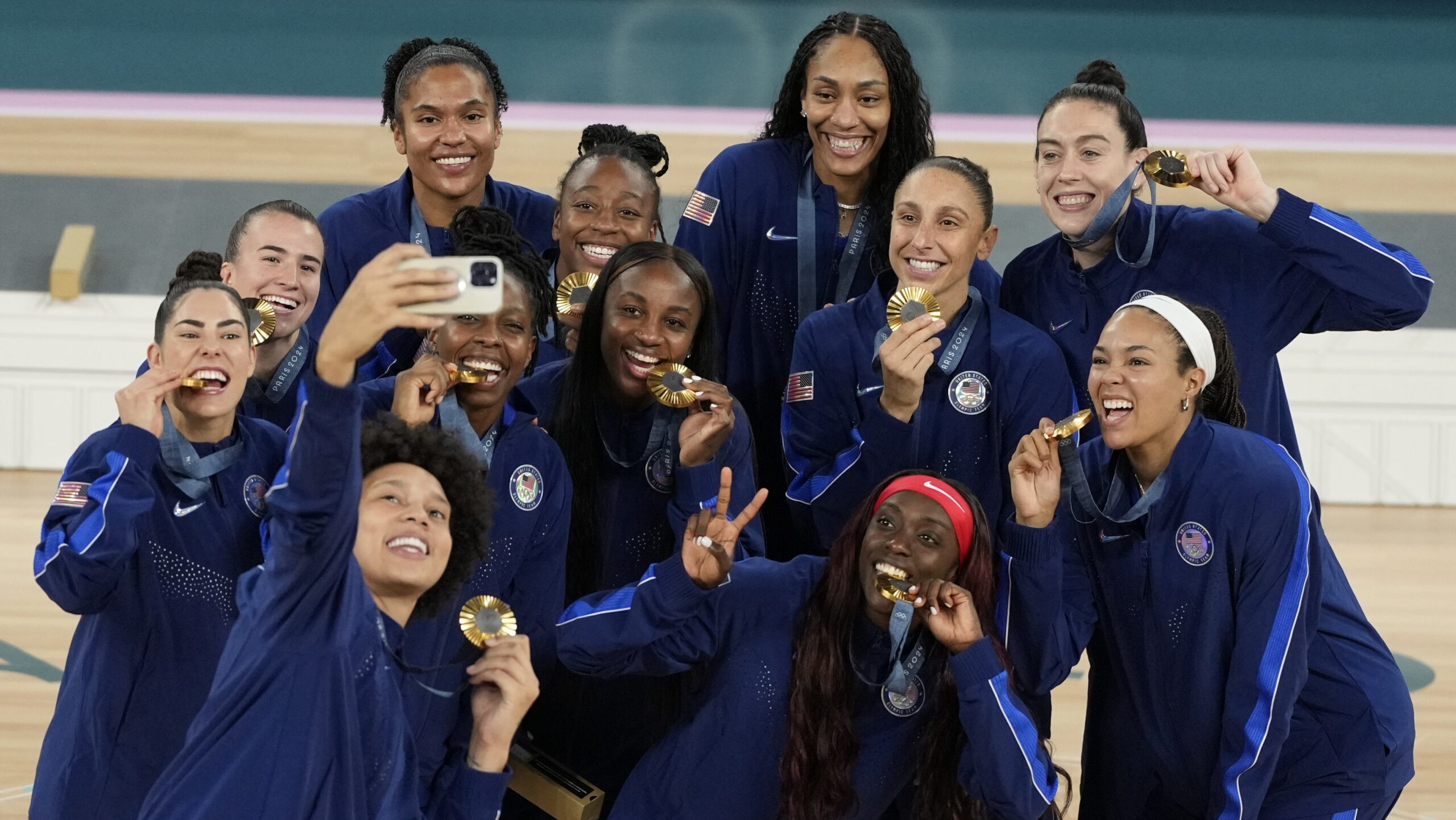 The United States team poses for a picture with their gold medals at Bercy Arena at the 2024 Summer...