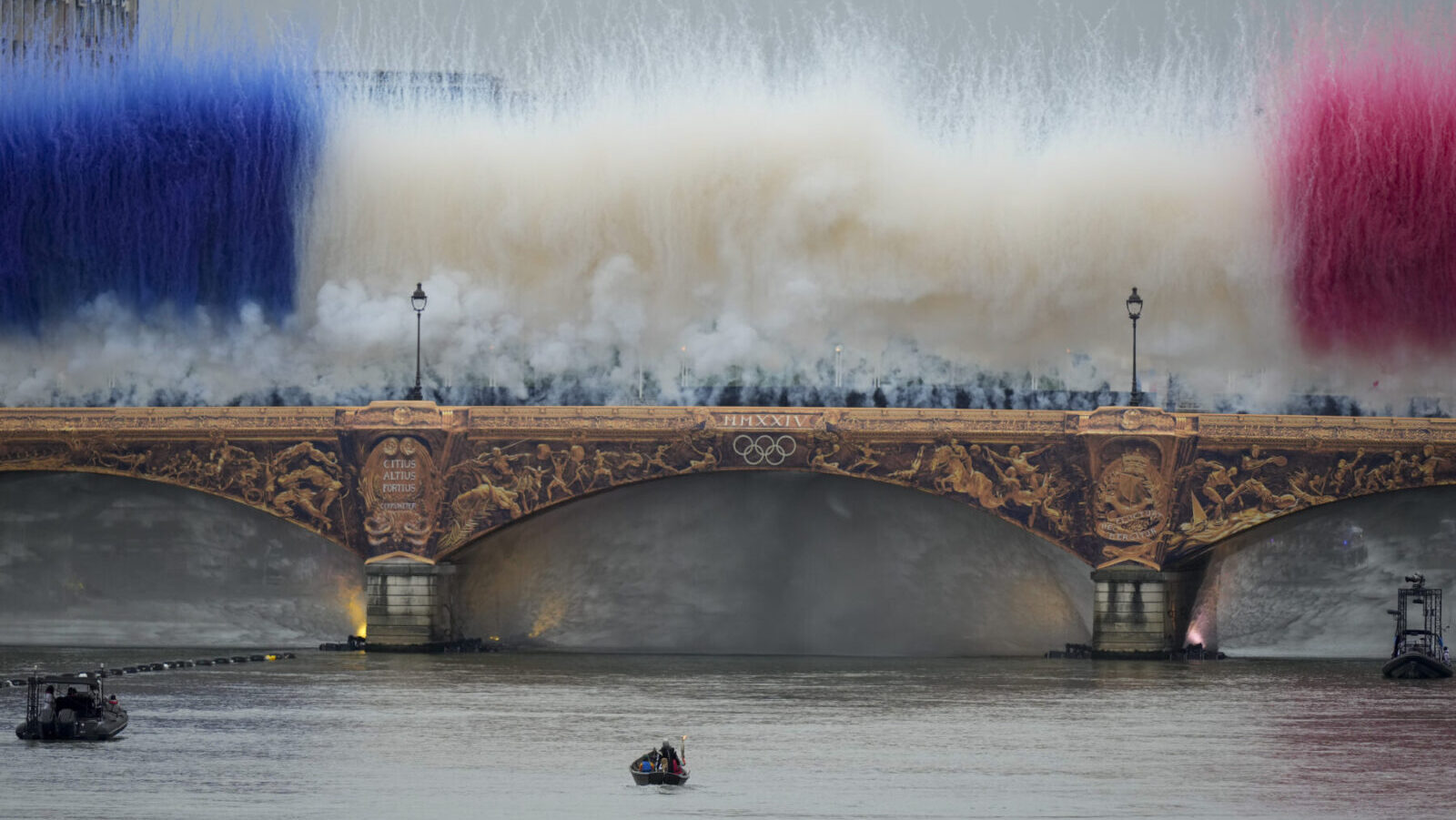 View of Seine River as Olympic torch travels by boat to destination...