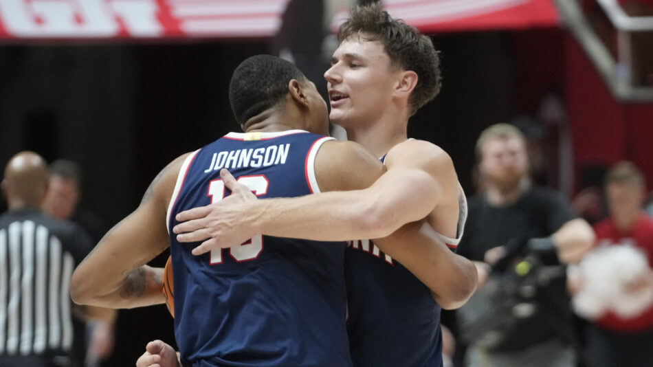 Pelle Larssson hugs Keshad Johnson...