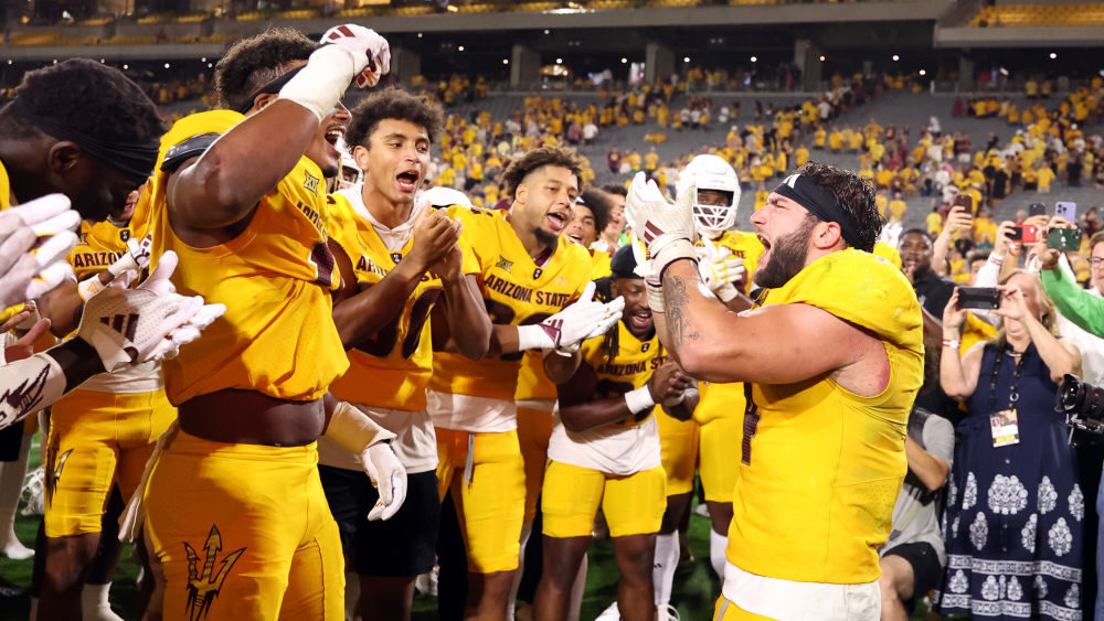Running back Cam Skattebo #4 of the Arizona State Sun Devils celebrates...