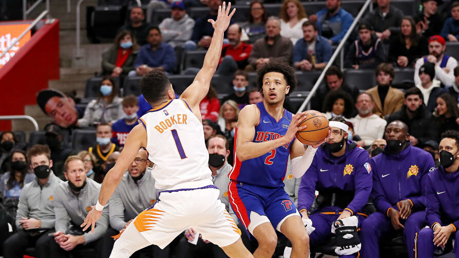 Suns guard Devin Booker and Pistons guard Cade Cunningham...