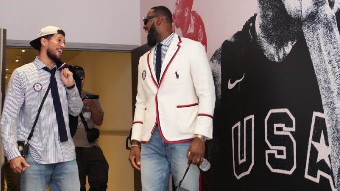Devin Booker and LeBron James wearing Ralph Lauren outfits before the 2024 Paris Olympics opening c...