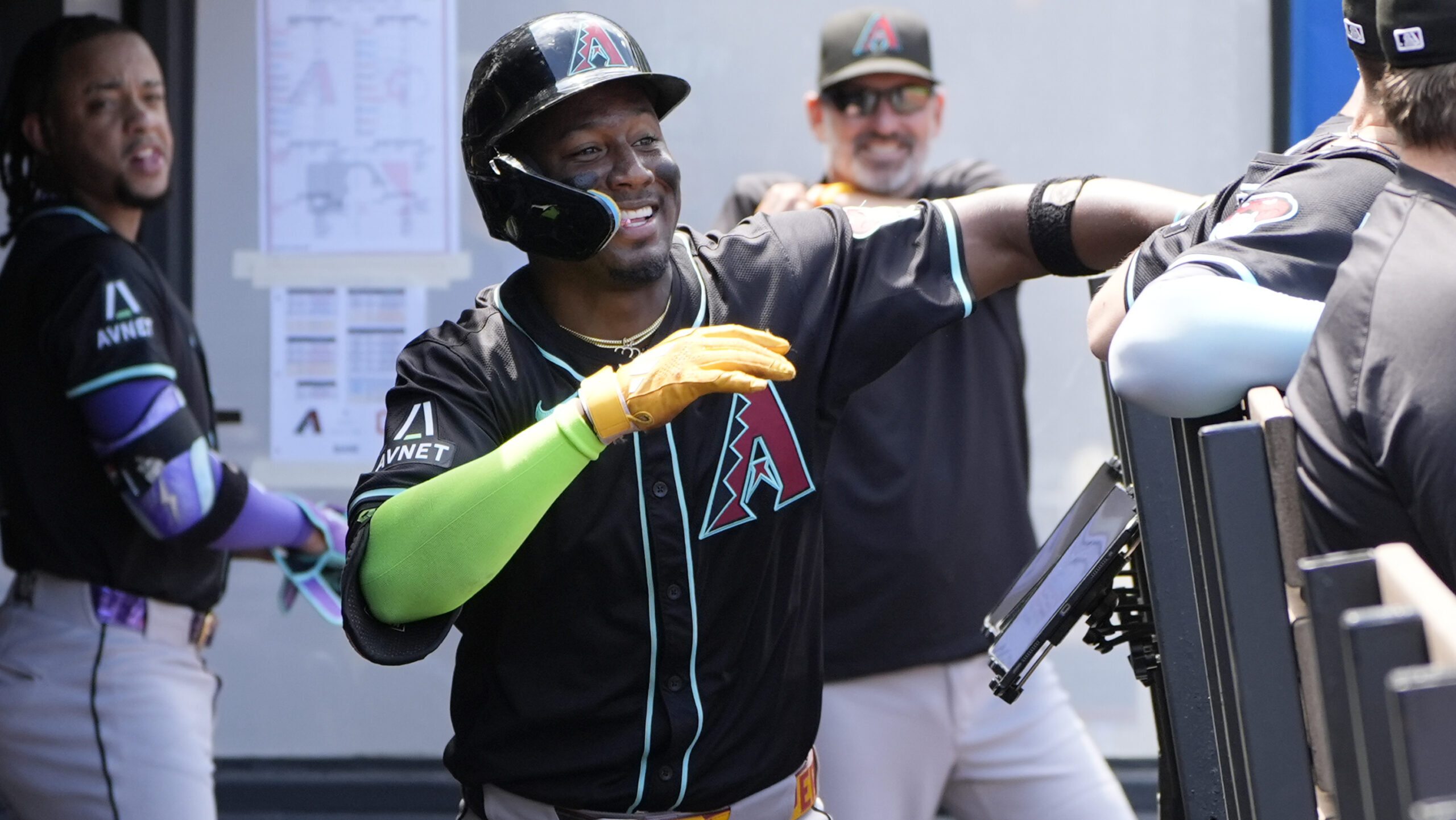 Arizona Diamondbacks' Geraldo Perdomo celebrates his home run with teammates in the second inning o...