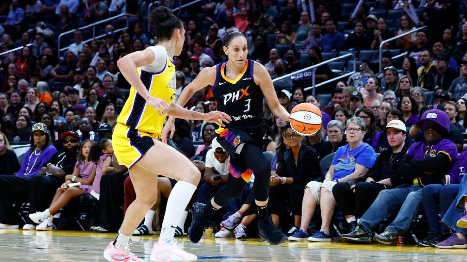 Diana Taurasi #3 of the Phoenix Mercury controls the ball against Kia Nurse #10 of the Los Angeles ...