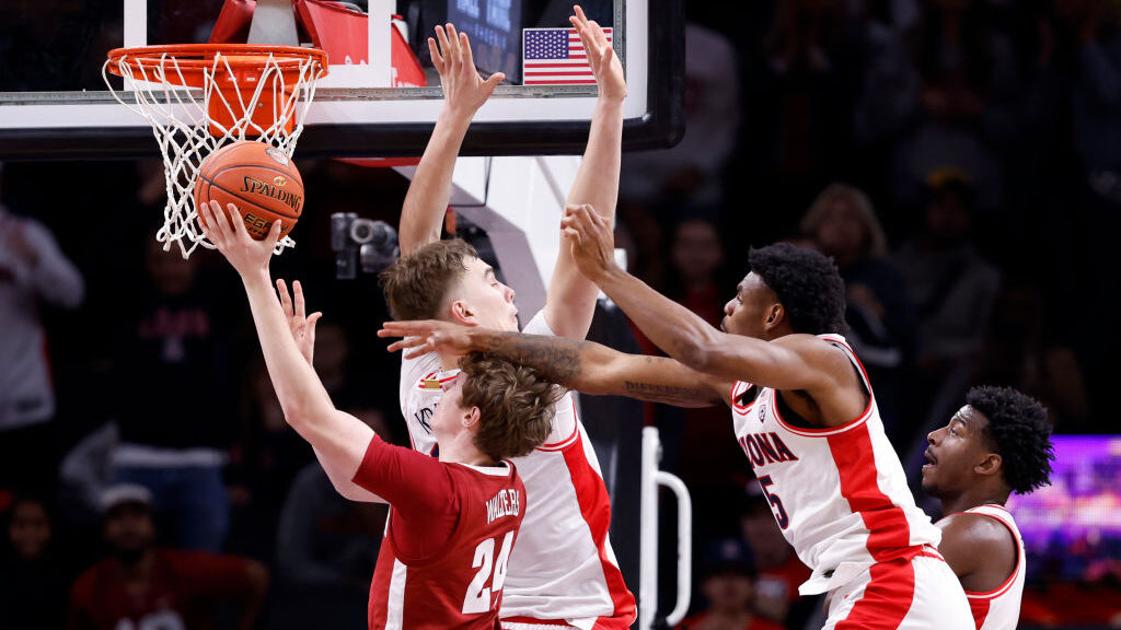 Sam Walters #24 of the Alabama Crimson Tide attempts a layup against Motiejus Krivas #14 of the Ari...