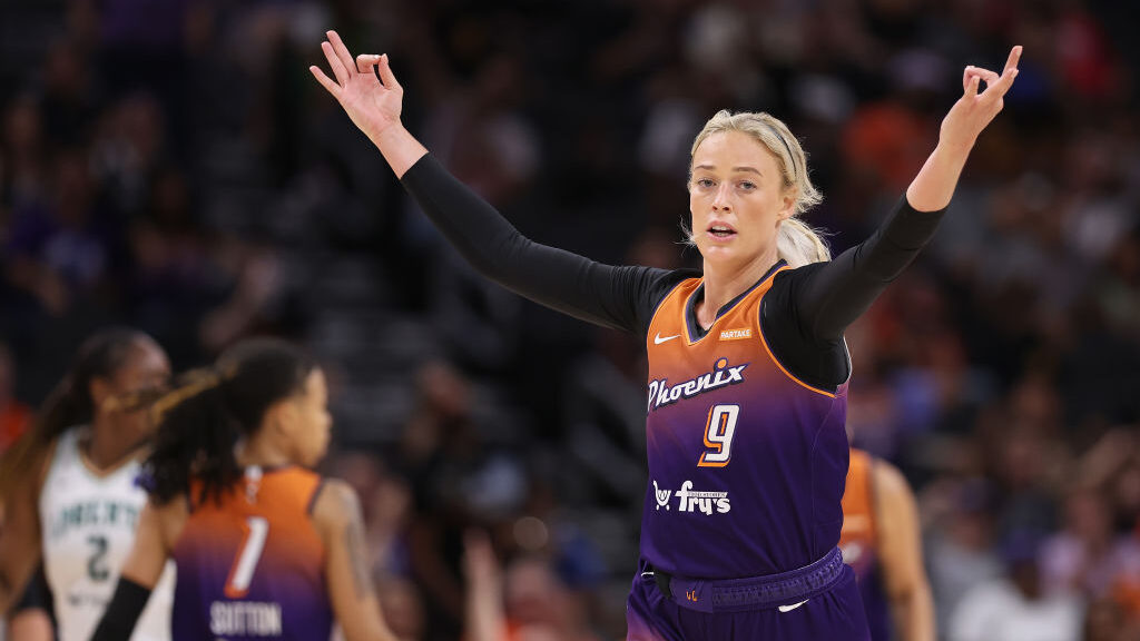 Sophie Cunningham #9 of the Phoenix Mercury reacts to a three-point shot against the New York Liber...