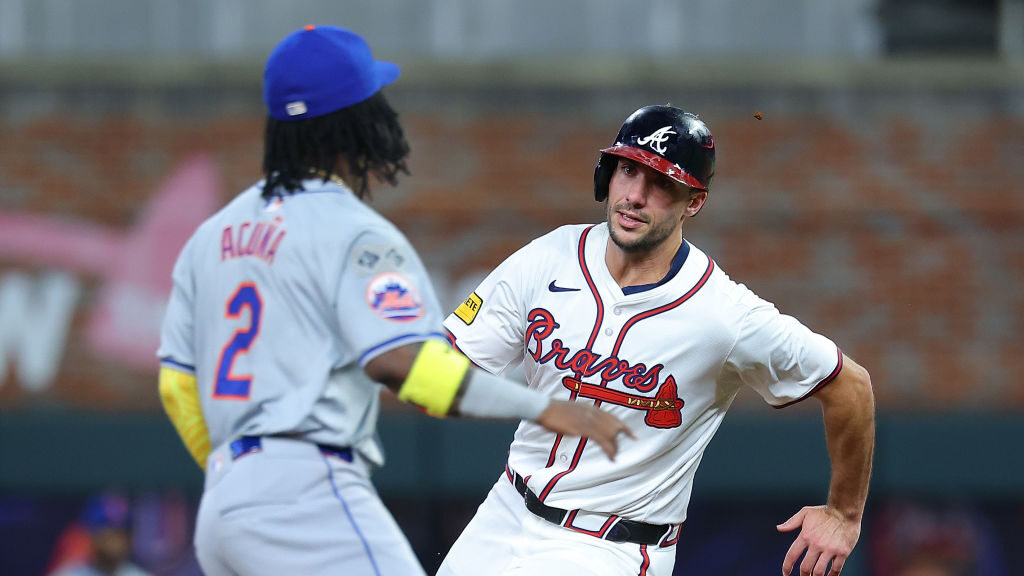Matt Olson #28 of the Atlanta Braves advances around second base on a RBI single by Ramon Laureano ...