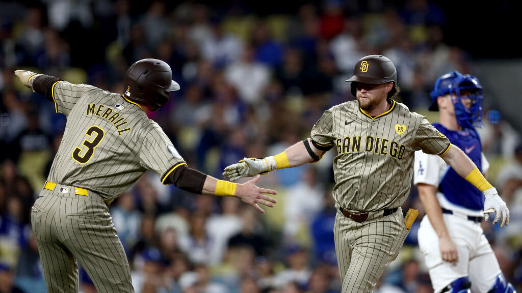 Jake Cronenworth #9 of the San Diego Padres celebrates his two run home run with teammate Jackson M...