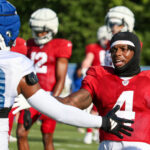 Arizona Cardinals WR Greg Dortch high fives Colts CB Kenny Moore II during Day 1 of joint practice on Wednesday, Aug. 14, 2024, in Indianapolis. (Tyler Drake/Arizona Sports)