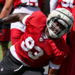 Arizona Cardinals DL Justin Jones runs through drills during Week 1 practice on Thursday, Sept. 5, 2024, in Tempe. (Tyler Drake/Arizona Sports)