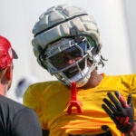 Arizona Cardinals CB Max Melton talks with a trainer during practice on Thursday, Sept. 12, 2024, in Tempe. (Tyler Drake/Arizona Sports)