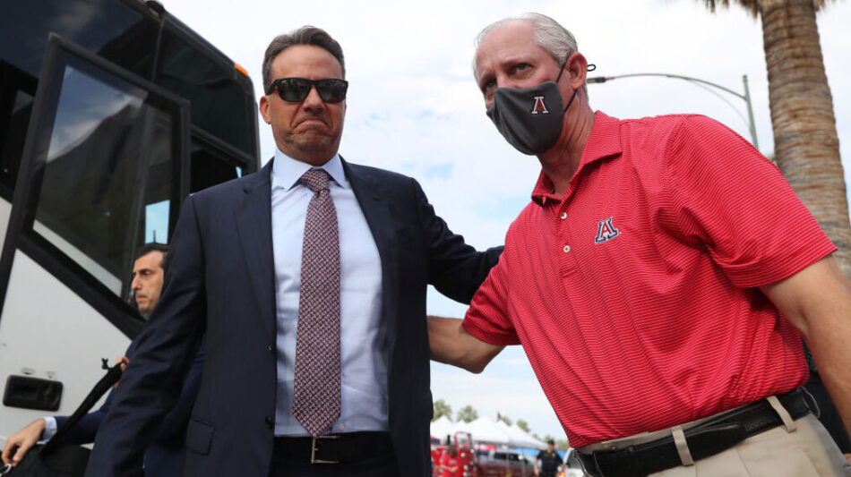 Arizona football coach Jedd Fisch and president Dr. Robert Robbins...