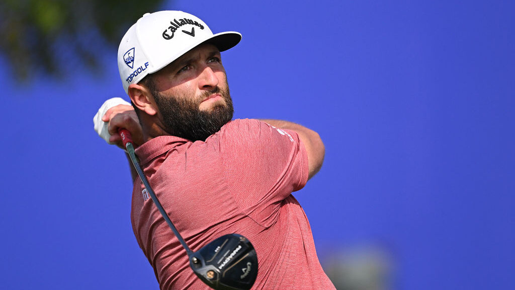Jon Rahm drives the golf ball...