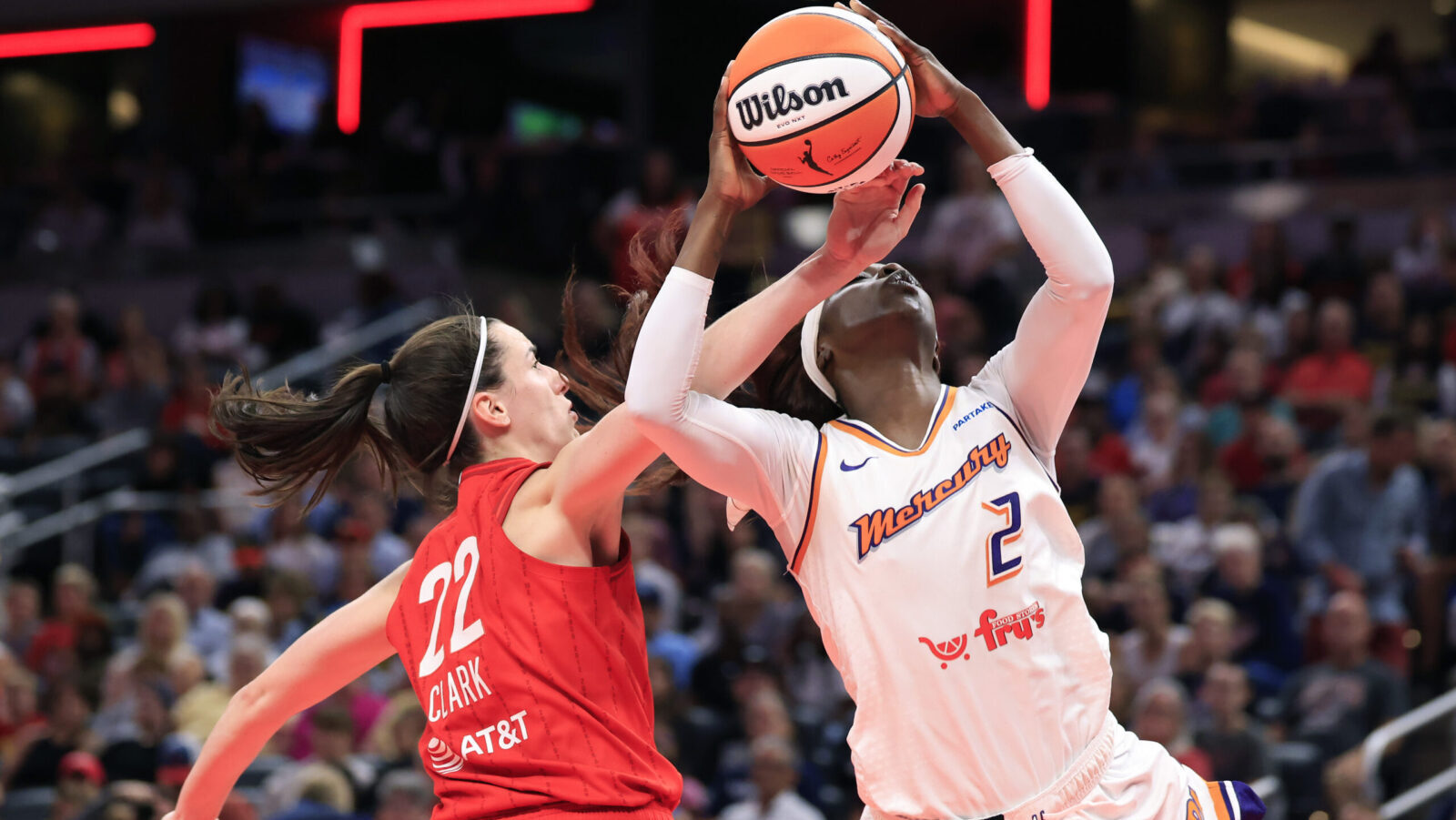 Phoenix Mercury's Kahleah Copper contested by Indianapolis Fever's Caitlin Clark...