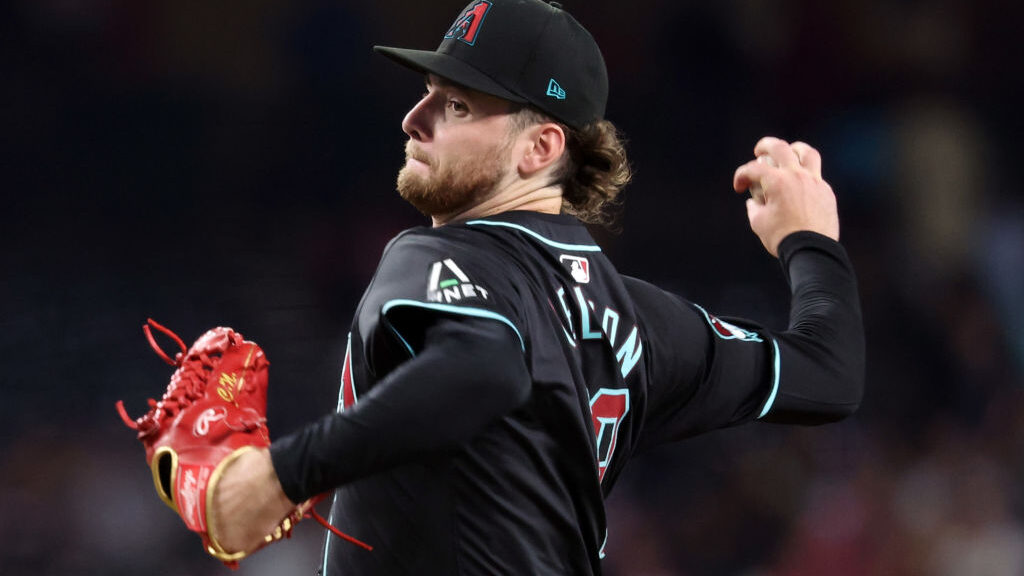 Starter Ryne Nelson #19 of the Arizona Diamondbacks pitches against the Toronto Blue Jays during th...