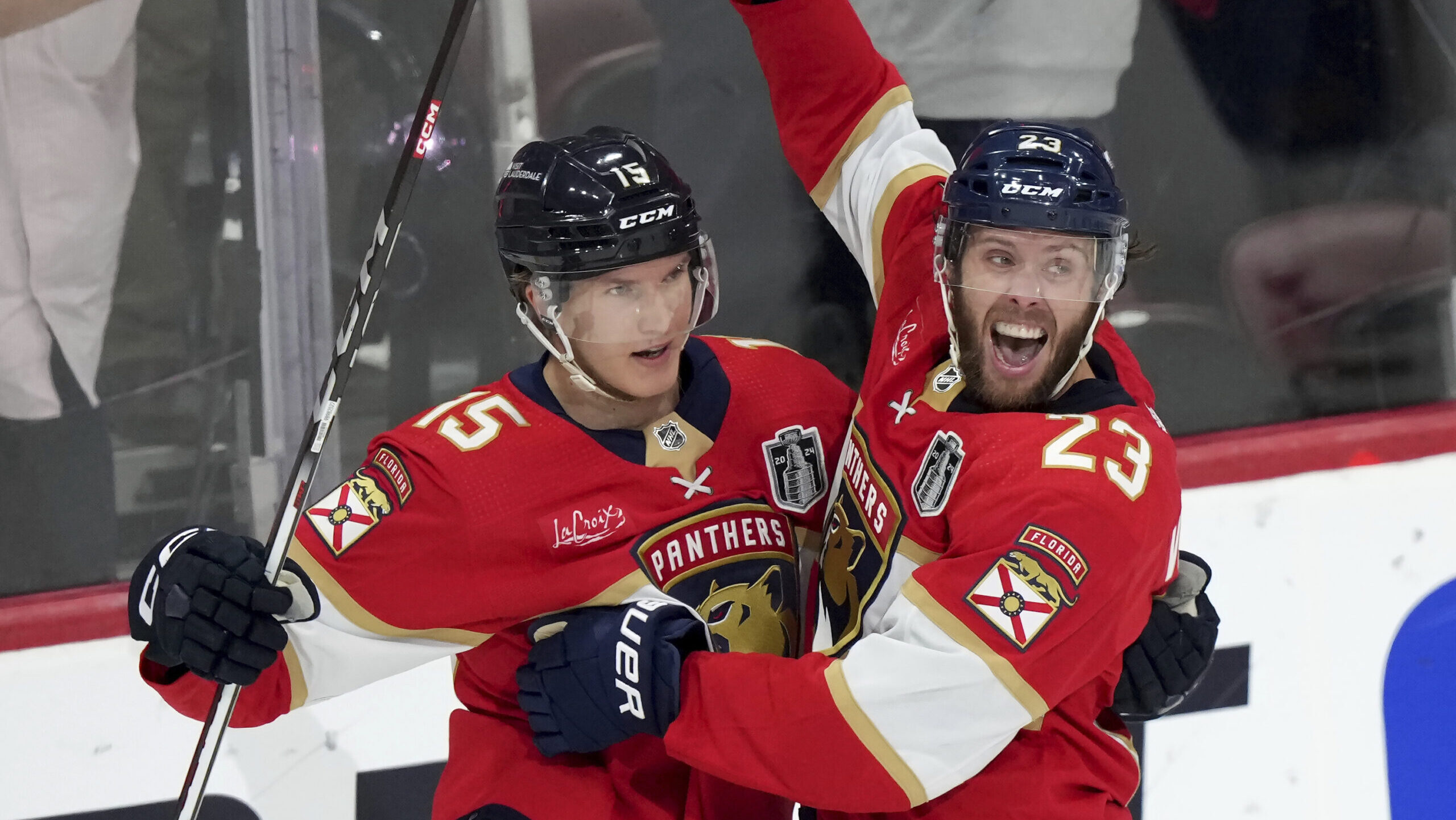 Florida Panthers forward Carter Verhaeghe (23) celebrates his goal with teammate Anton Lundell (15)...