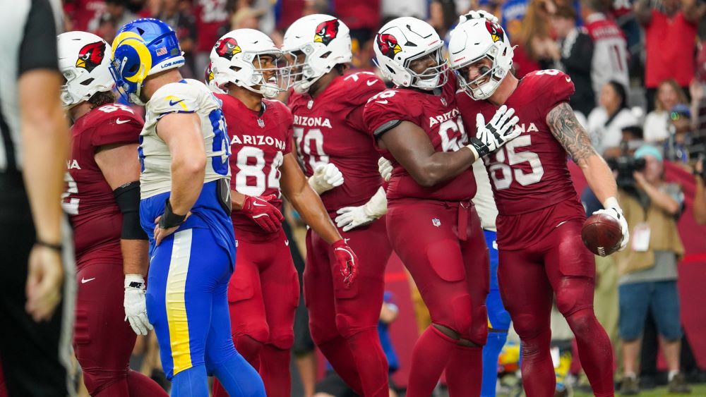 Arizona Cardinals tight end Trey McBride celebrates...